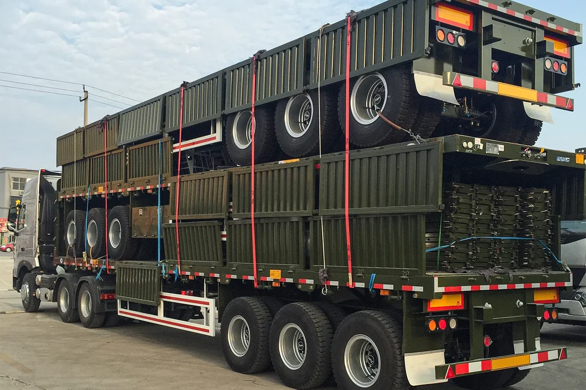 3 axle fence cargo semi trailers stacked and secured for export shipment