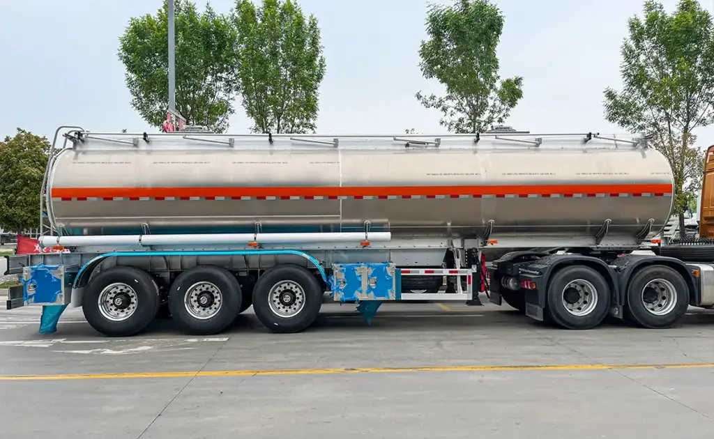 3-axle liquid tanker semi trailer with a polished cylindrical tank built for fuel, water and chemical transport