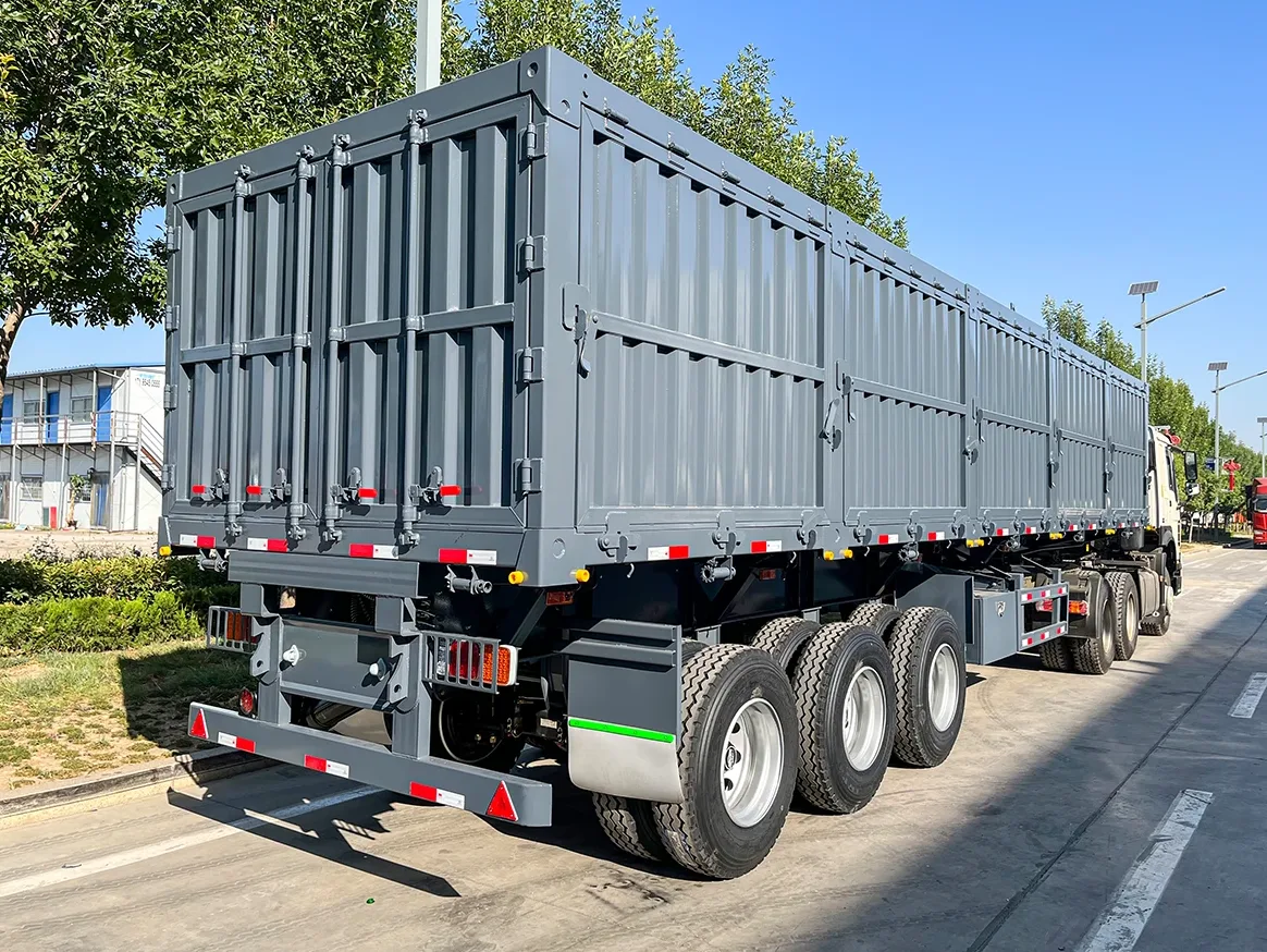 3-axle side dump semi trailer tipping at a mine haulage circuit — side tipping formats inside the tipper trucks market